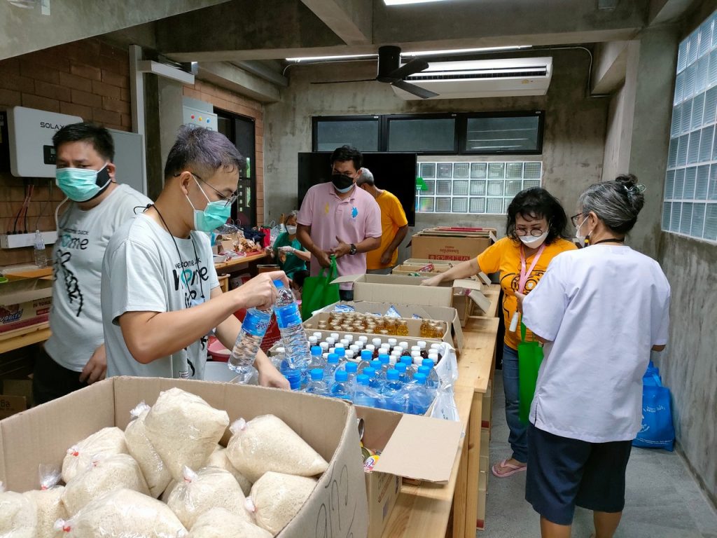 volunteers at The Innocent Perception Centre prepare survival bags for destiture locals